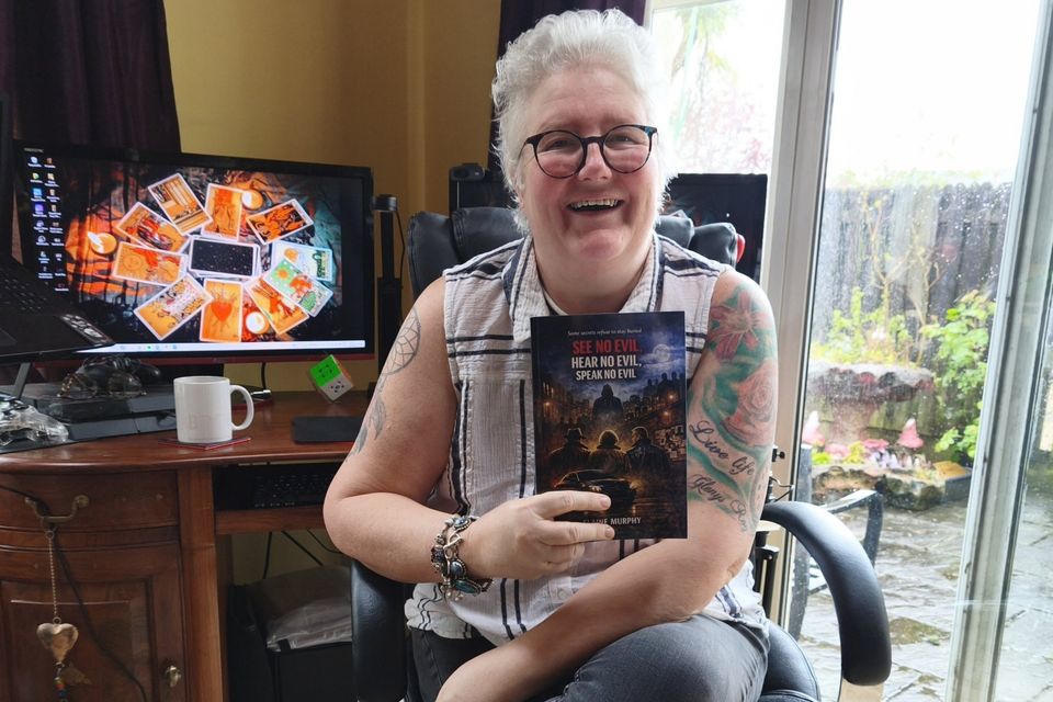 Arklow author and cancer survivor Elaine Murphy holds her debut novel 'See No Evil, Hear No Evil, Speak No Evil'.